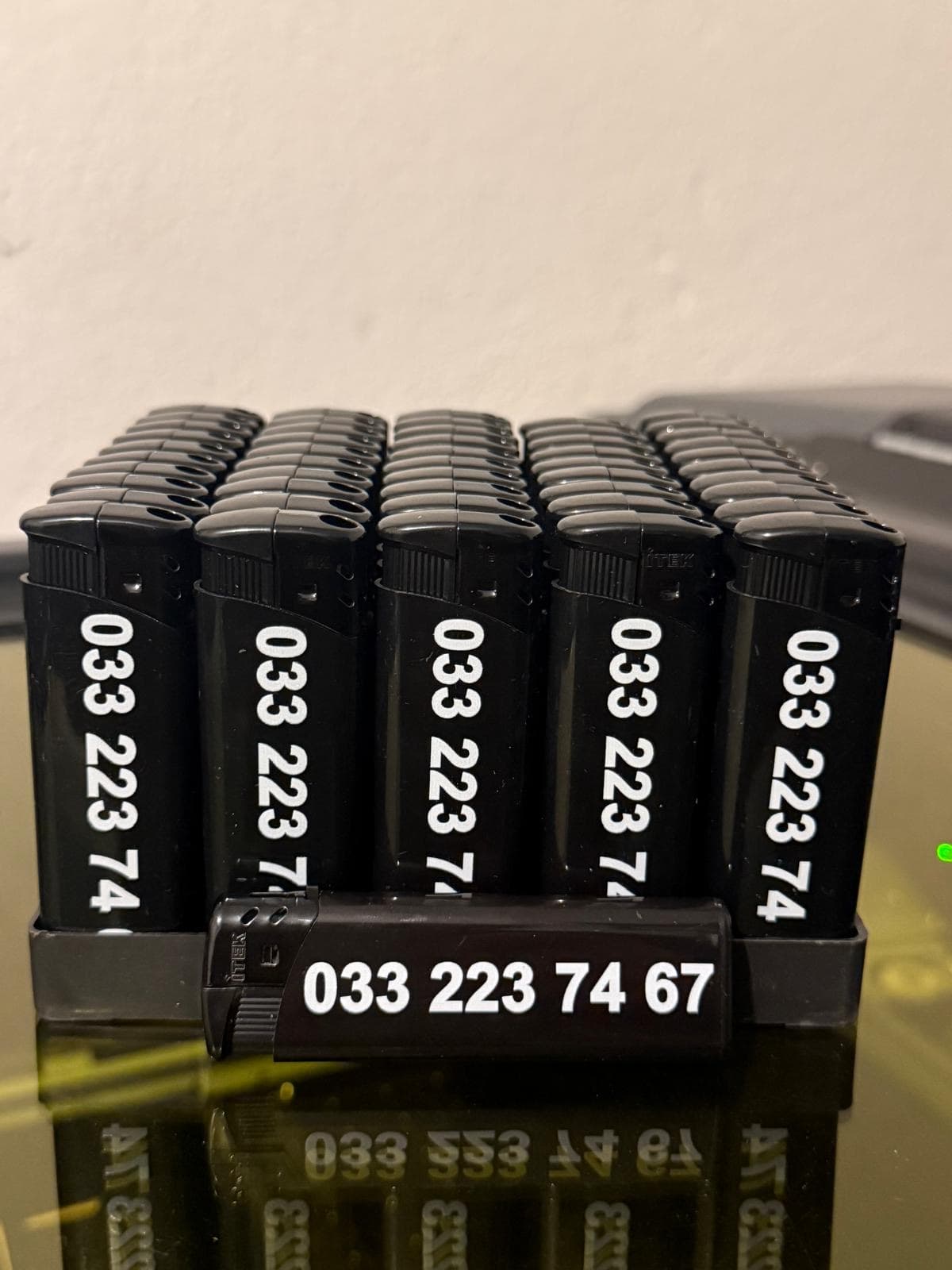 Werbefeuerzeuge mit Telefonnummer